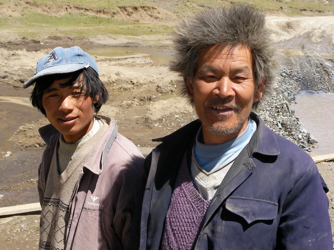 Chinese construction workers where sent out here to build a new bridge. This guys said that when he came out here some months ago he had a buzz cut. Saga, Tibet.